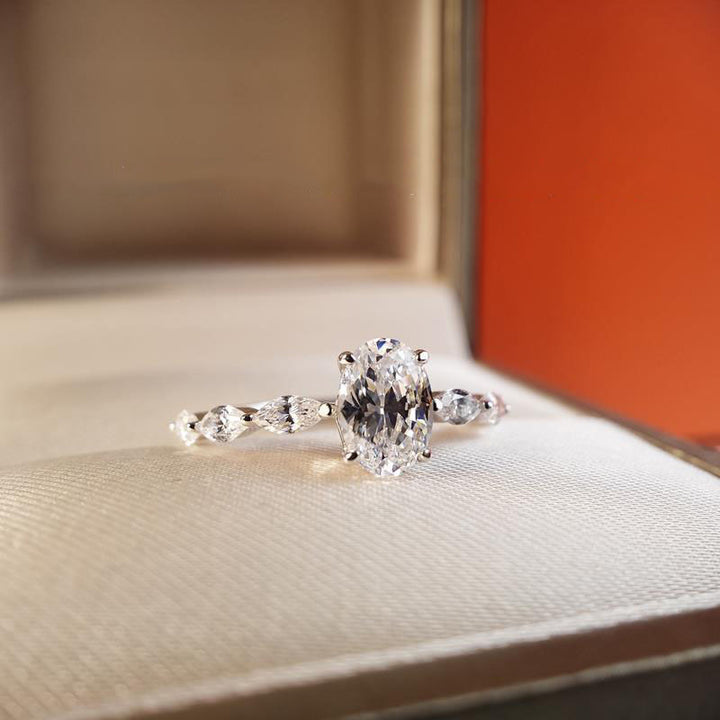 Oval Center Stone with Marquise Side Diamonds Ring