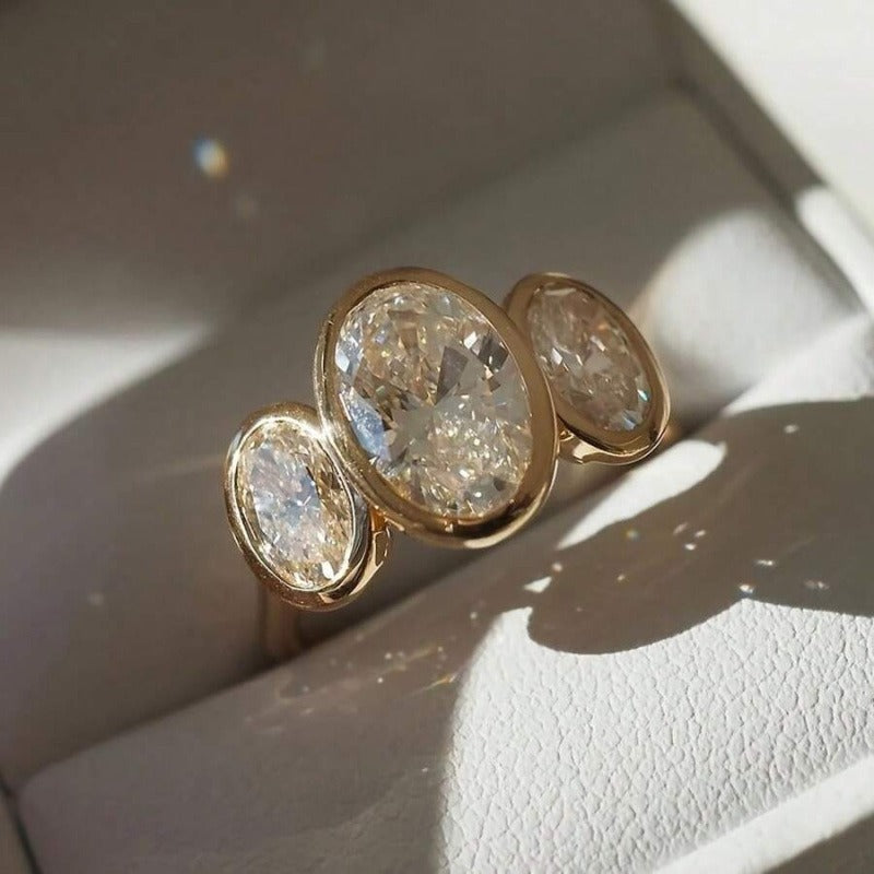 Gilded Circle Harmony 18K Gold Bezel-Set Three-Stone Ring