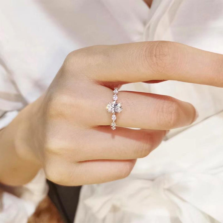 Oval Center Stone with Marquise Side Diamonds Ring