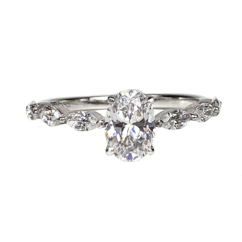Oval Center Stone with Marquise Side Diamonds Ring