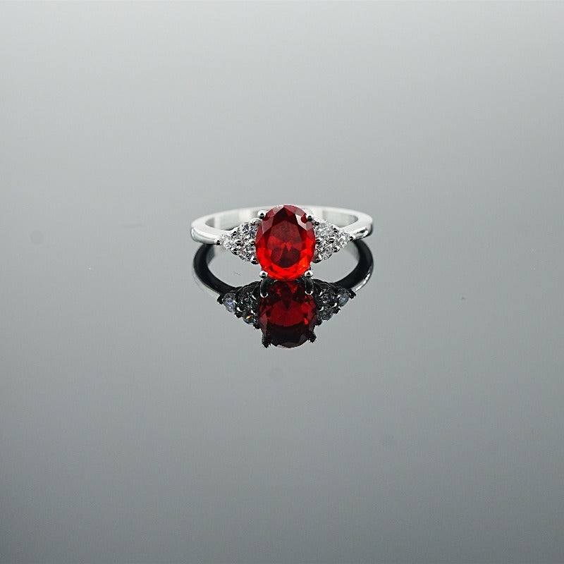 Classic Oval-Cut Colored Gemstone Ring | Elegant Three-Stone Design