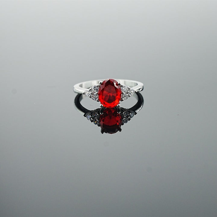 Classic Oval-Cut Colored Gemstone Ring | Elegant Three-Stone Design